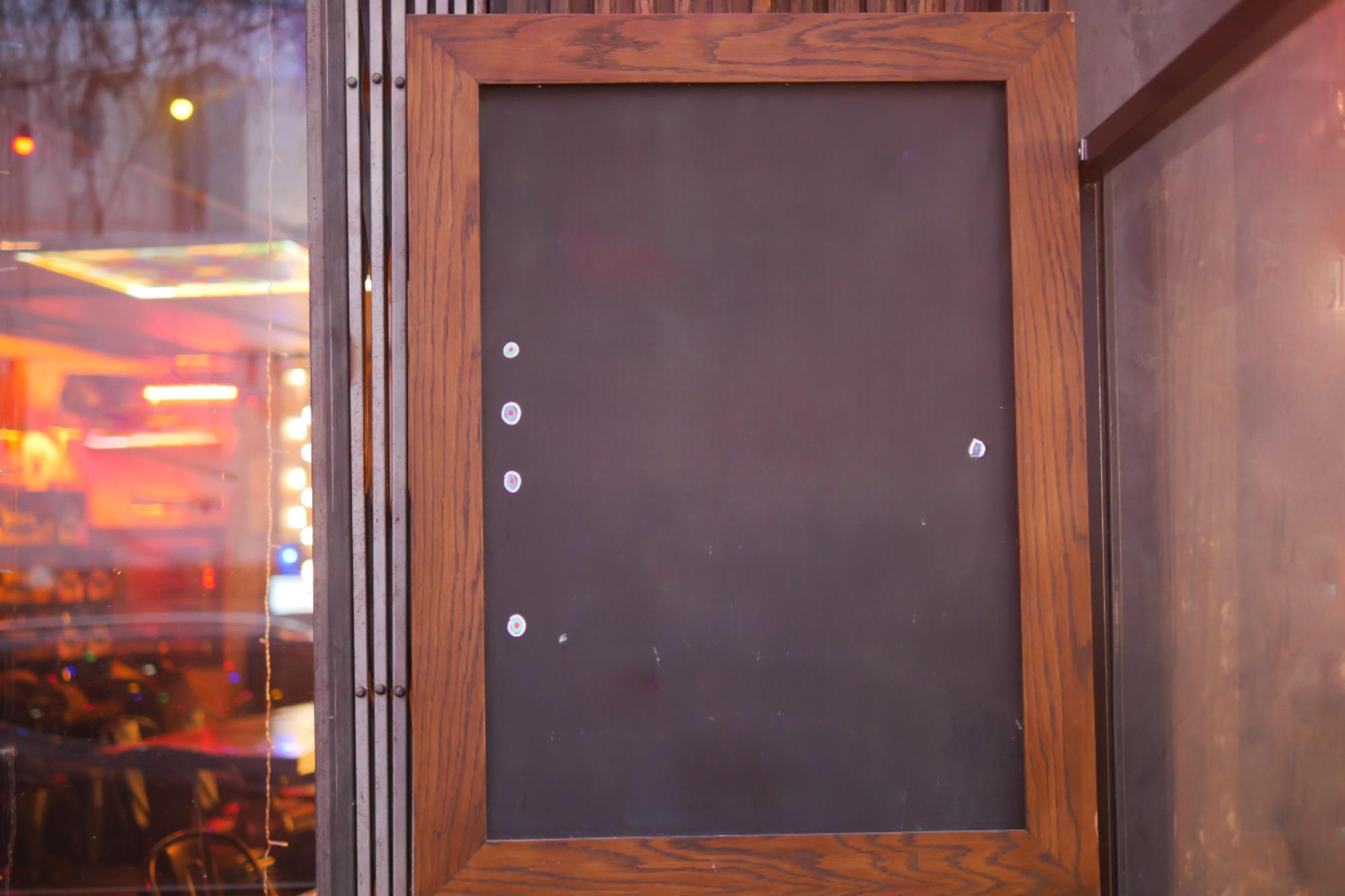 Studio exterior with closed door and sign