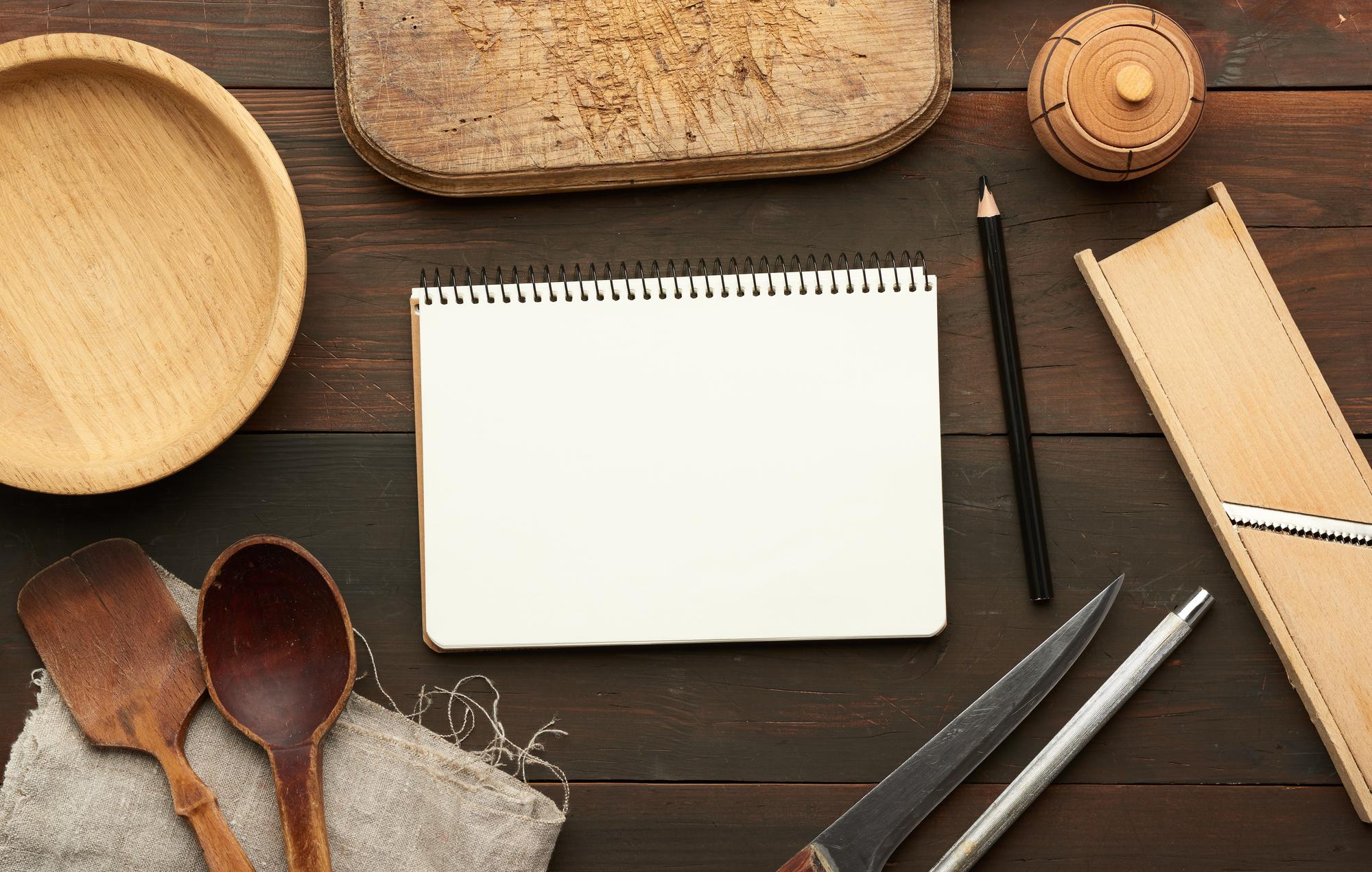 Notebook and plated sample near laptop for menu design